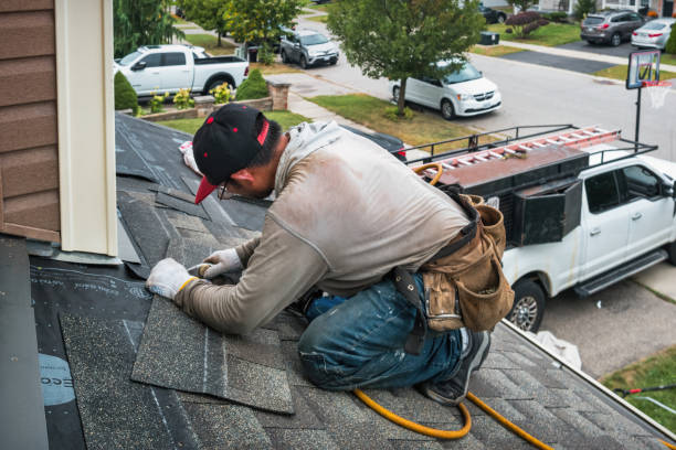 Professional Roofing technician working in Wauregan, CT